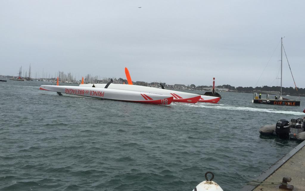 Ultime 80 Prince de Bretagne is towed back into her home port in Lorient after capsizing early in the 2015 Transat Jacques Vabre © Transat Jacques Vabre